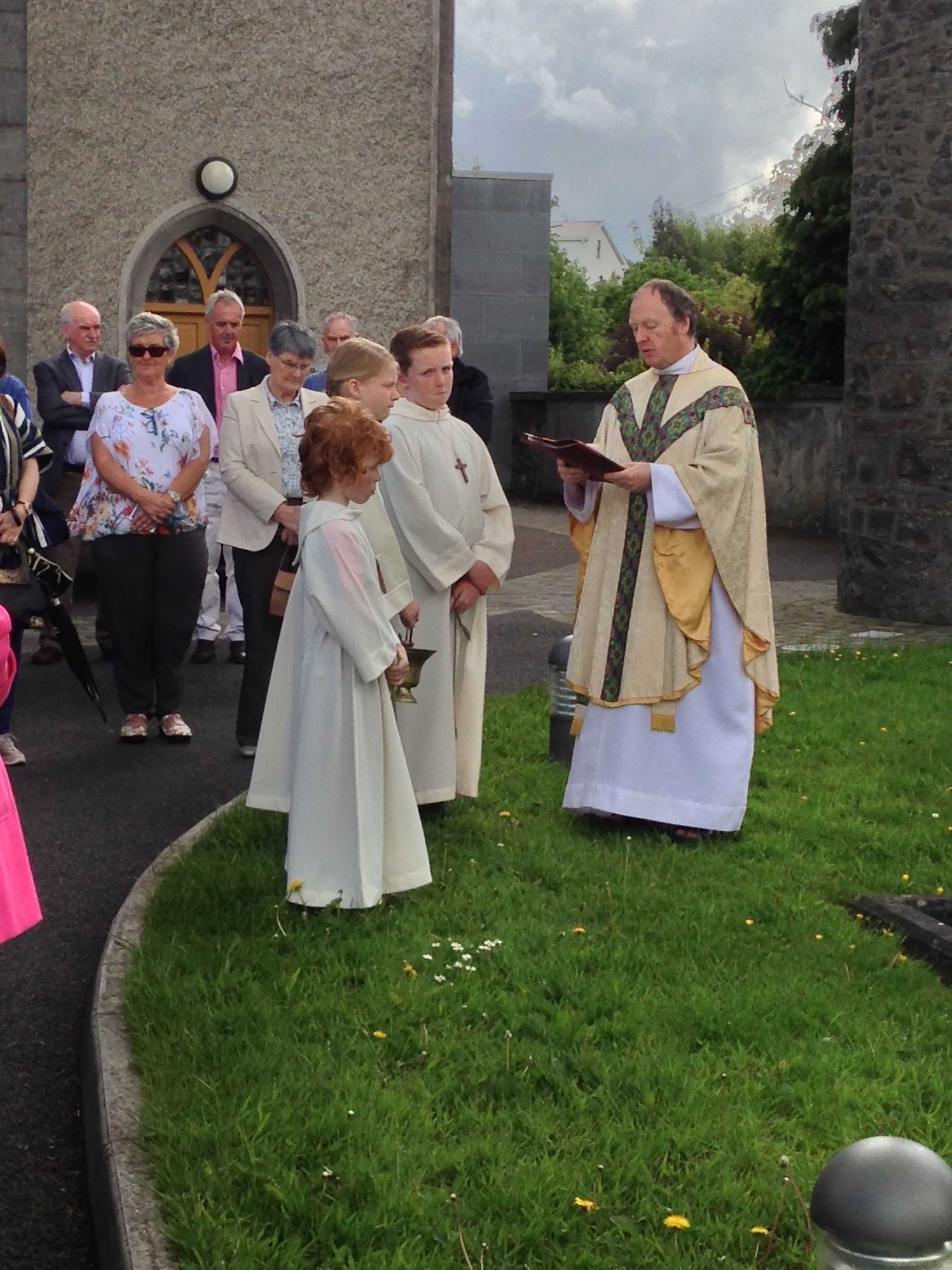 Blessing of the graves in the church yard of St. Patrick's at Slane. We found the red-headed altar  to be irresistible! Photo by Sara Burrus.